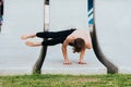 Astakrasana, an eight angle yoga asana to strengthen forearms trained by a young male athlete