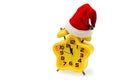 An asterisk Christmas clock shows the remaining time until midnight with a Santa Claus hat,on an white background.Yellow.12,Twelve Royalty Free Stock Photo