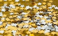 Asterisks shiny Christmas scattered on a gold background Royalty Free Stock Photo