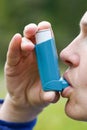 Asthma patient inhaling medication