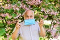Asthma treatment concept. Difficulty in breathing. Allergic reaction. Limit risk infection spreading. Senior man face Royalty Free Stock Photo