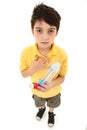 Asthmatic Child with Inhaler and Spacer Chamber Royalty Free Stock Photo