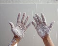 Astist plastering man hands with cracked plaster