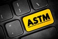 ASTM - American Society for Testing and Materials is an international standards organization, text button on keyboard, concept