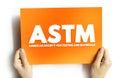 ASTM -American Society for Testing and Materials is an international standards organization, text concept on card