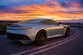 Aston Martin DBS superleggera on a scenic road at sunset Royalty Free Stock Photo