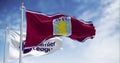 Aston Villa and Premier League flags waving on a clear day