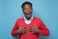 Astonished afro american guy being surprised receiving compliment. Royalty Free Stock Photo