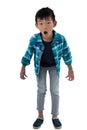 Astonished boy standing against white background Royalty Free Stock Photo