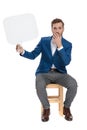 Astonished casual man holding an empty speech bubble Royalty Free Stock Photo