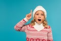 astonished child in warm sweater and Royalty Free Stock Photo