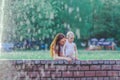 Astonished little girl is showing her mother the spray of the fountain. Royalty Free Stock Photo