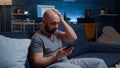 Astonished man by warning notification for unpaid bank bills Royalty Free Stock Photo