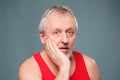 Astonished Senior Portrait of an amazed elderly man, looking intently and shocked in studio setting