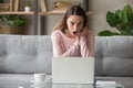 Astonished young lady stared at computer screen. Royalty Free Stock Photo