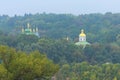 Astonishing foggy morning landscape view of famous Kyiv`s hills against blue sky. The domes Saint George`s Cathedral Royalty Free Stock Photo