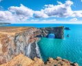 Astonishing landscape with unique basalt arch on Dyrholaey Nature Reserve on Atlantic South Coast Royalty Free Stock Photo