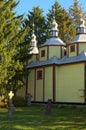 Astonishing landscape view of ancient wooden cossack church with small cemetery in forest.