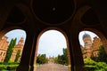 Astonishing landscape view of front yard with green trees and bushes of Chernivtsi University against sky.