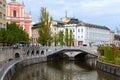 Astonishing landscape view of the old city. Ljubljanica River with famous Triple Bridge