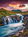 Astonishing summer sunset on Bruarfoss Waterfall, secluded spot with cascading blue waters. Royalty Free Stock Photo