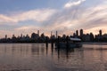 Astoria Queens Ferry Boat Stop with a Colorful Sunset over the Roosevelt Island and Manhattan Skyline along the East River in New Royalty Free Stock Photo