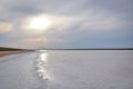 Sun over a small salt lake Royalty Free Stock Photo