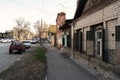 Astrakhan, Russia 12 of April 2018: In The Street Of Astrakhan In Sunny Spring Day With Cars Parked About Old Houses