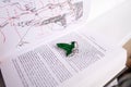 Astrakhan, Russia - 03.26.2021: Green brooch on Lord of the Rings book Royalty Free Stock Photo