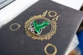 Astrakhan, Russia - 03.26.2021: Green brooch on Lord of the Rings book Royalty Free Stock Photo