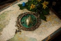 Astrakhan, Russia March 1, 2022 Middle Earth map with Elven Lorien brooch lying on it