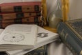 Astrology books and hourglass in psychic office