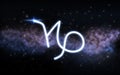 Capricorn zodiac sign over night sky and galaxy Royalty Free Stock Photo