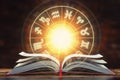 Astrology horoscope concept. Opened  book with magic zodiac signs and symbols Royalty Free Stock Photo