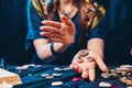 Astrology and magic. A witch holds a stones with the sign of the zodiac. Close up. The concept of horoscopes and telling