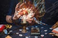 Astrology and online divination. A fortune teller does online fortune telling on photos from a smartphone. The zodiac circle is