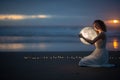 Astrology. Secret and riddle. Beautiful attractive girl on a night beach with sand hugs the moon, art photo