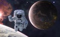 Astronaut on background of a colonized planet. Planets of deep space in warm starlight. Science fiction