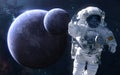 Astronaut on background of exoplanets in deep space. Science fiction