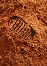 Astronaut footprint on red Martian sand
