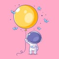 Astronaut carrying a yellow balloon