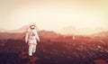 Astronaut doing space walk and explore planet such as Mars Royalty Free Stock Photo