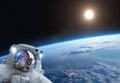 Astronaut, Earth ans Sun