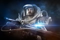 Astronaut, fantasy warrior with huge space weapon Royalty Free Stock Photo