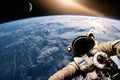 Astronaut float in the space in weightlessness near to planet earth