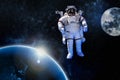 Astronaut float in the space in weightlessness near to planet earth