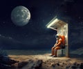 Astronaut in full space gear sits at a bus stop at night waiting for a transport. Sci fi concept. Generative AI