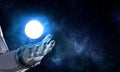 Moon planet in spaceman hand. Mixed media Royalty Free Stock Photo