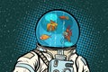 Astronaut with helmet aquarium with fish