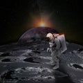 Astronaut on moon surface with space background.